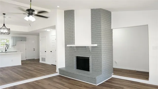 a kitchen with a sink cabinets and a window