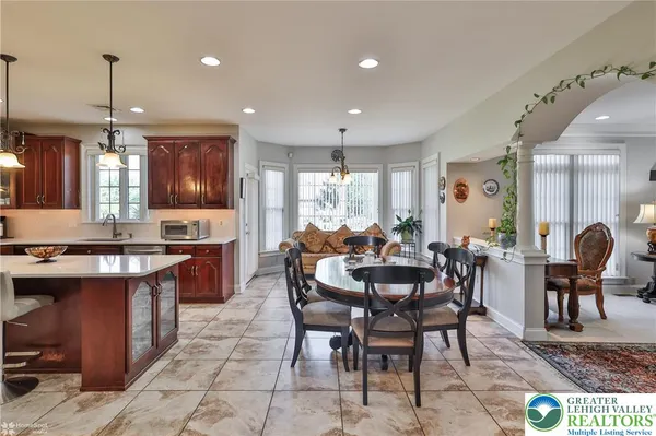 a kitchen with a sink a stove and cabinets