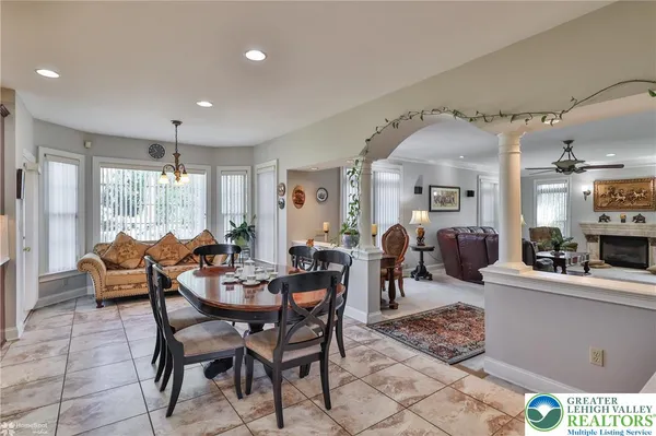 a large kitchen with a table and chairs