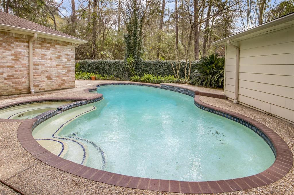 Weekly pool service is included! Private backyard oasis right in Kingwood.
