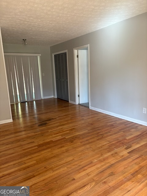135 Preston Place LaGrange, GA 30241 - Photo 2 of 6 a view of an empty room with wooden floor