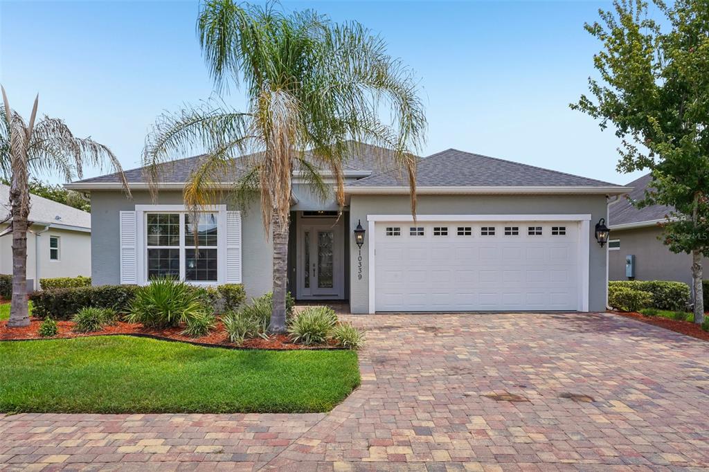 10339 Addison Shore Way Oxford, FL 34484 - Photo 21 of 54 a front view of house with yard and green space