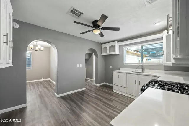 a view of a kitchen with a sink and a window