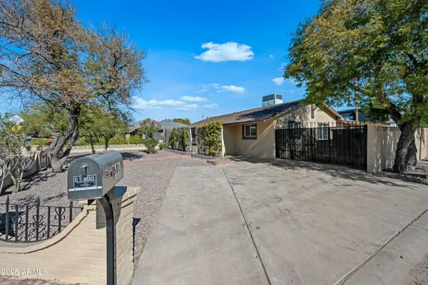 a view of house with yard and entertaining space