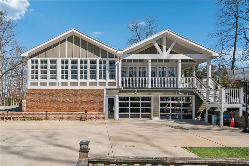 13360 Freemanville Road Milton, GA 30004 - Photo 1 of 1 a front view of a house with a yard