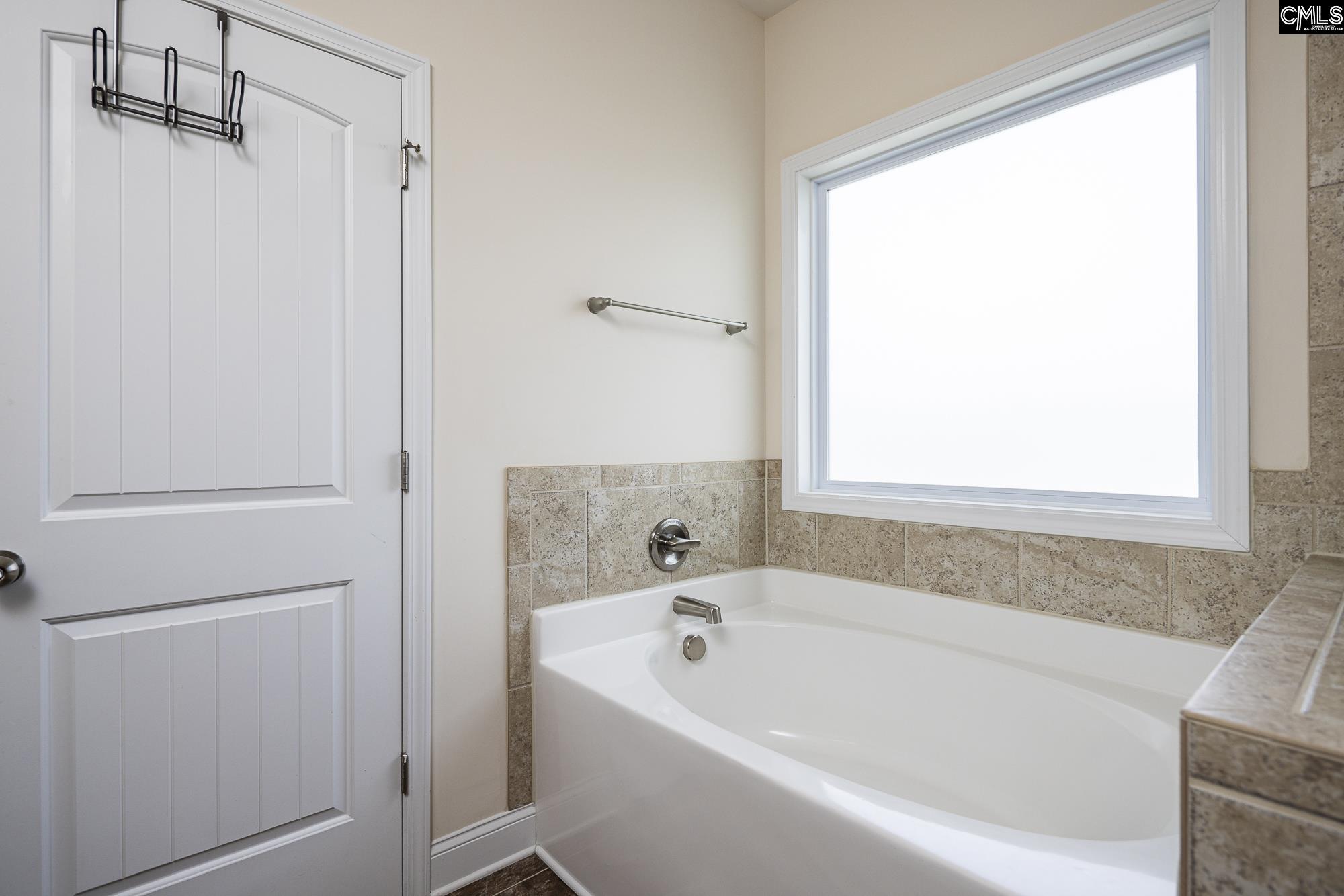 213 Sunset Point Drive Lexington, SC 29072 - Photo 23 of 35 a white bath tub sitting next to a window