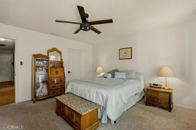 a bedroom with a bed and dresser