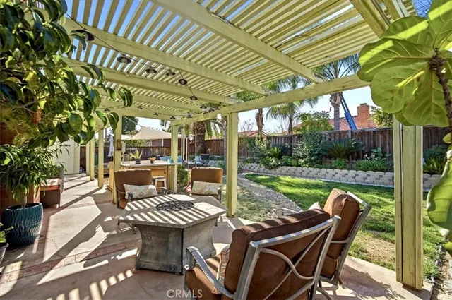 a view of a patio with a table chairs and a patio