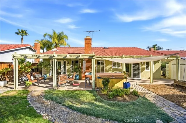 a front view of a house with a yard table and chairs