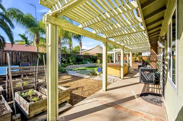 a view of a porch with furniture and garden view