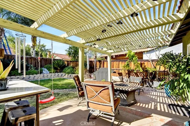 a view of yard with patio