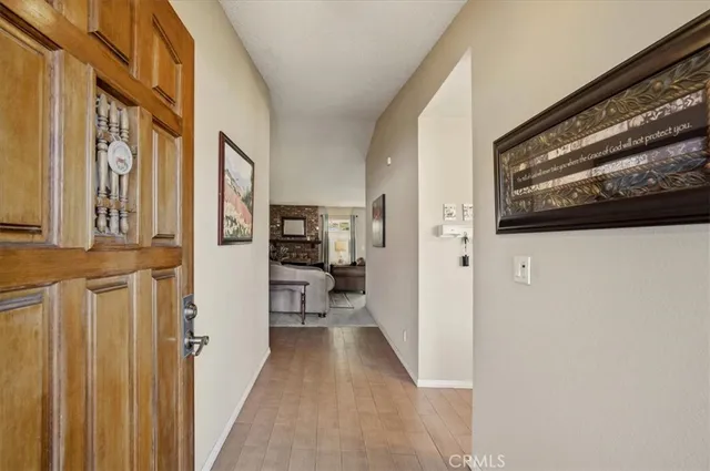 a view of a hallway with a furniture and entryway