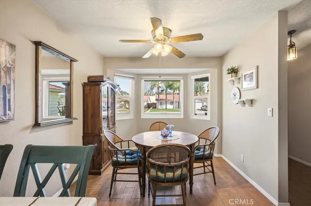 a dining room with furniture and window