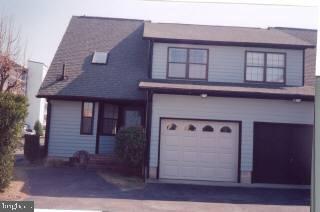 0 Edward Taylor Road, Unit 904 Ocean City, MD 21842 - Photo 1 of 3 a front view of a house with a garage