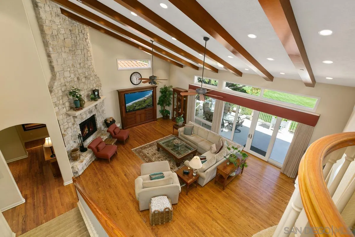 15629 Boulder Mountain Road Poway, CA 92064 - Photo 19 of 64 a living room with furniture and a fireplace