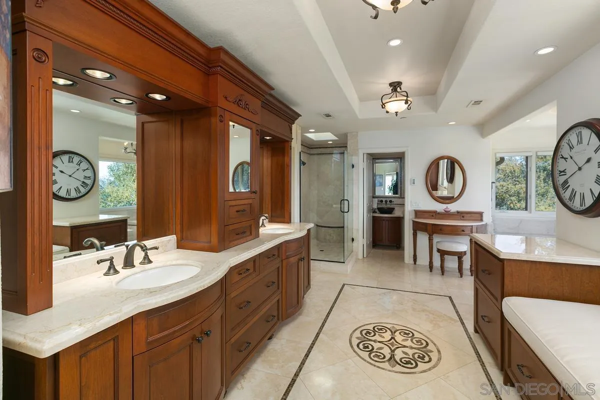 15629 Boulder Mountain Road Poway, CA 92064 - Photo 23 of 64 a large spacious bathroom with a double vanity sink and a mirror