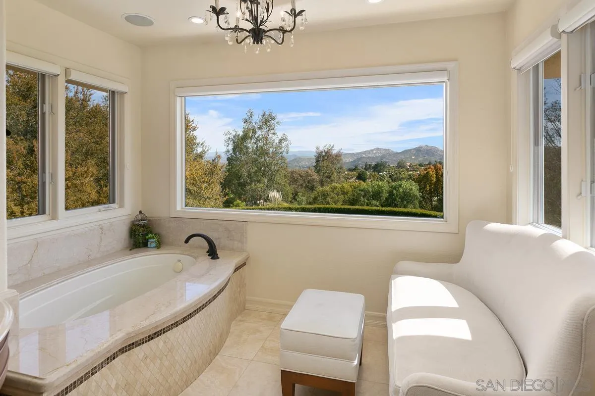 15629 Boulder Mountain Road Poway, CA 92064 - Photo 24 of 64 a bath tub sitting next to a window