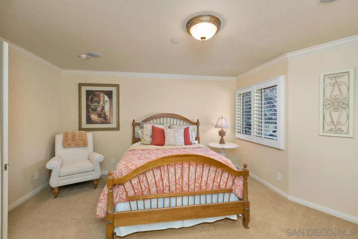 15629 Boulder Mountain Road Poway, CA 92064 - Photo 27 of 64 a bedroom with a bed and a table