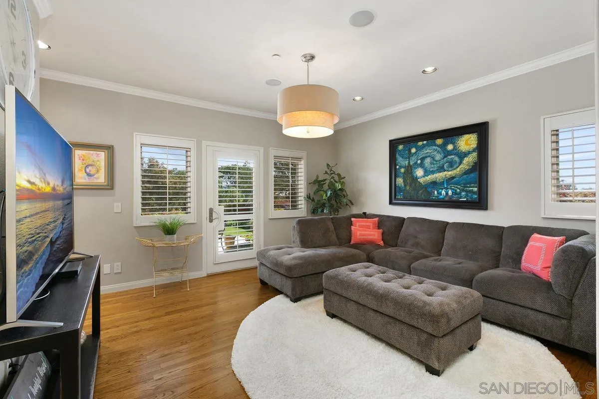 15629 Boulder Mountain Road Poway, CA 92064 - Photo 28 of 64 a living room with furniture a flat screen tv and wooden floor
