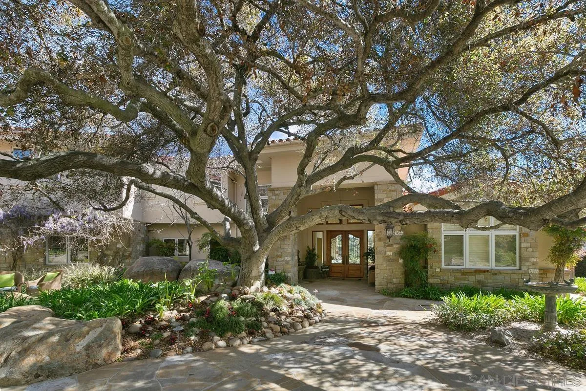 15629 Boulder Mountain Road Poway, CA 92064 - Photo 3 of 64 a front view of a house with a garden