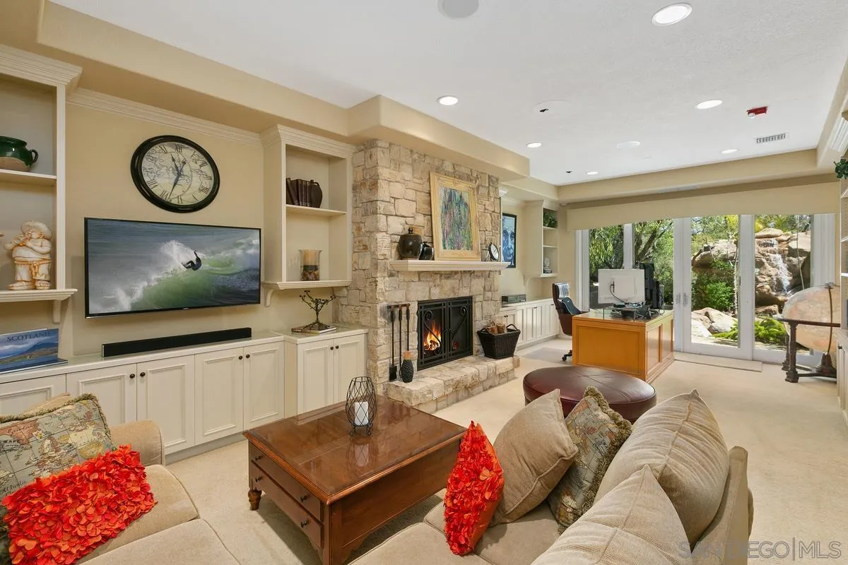 15629 Boulder Mountain Road Poway, CA 92064 - Photo 40 of 64 a living room with furniture and a flat screen tv