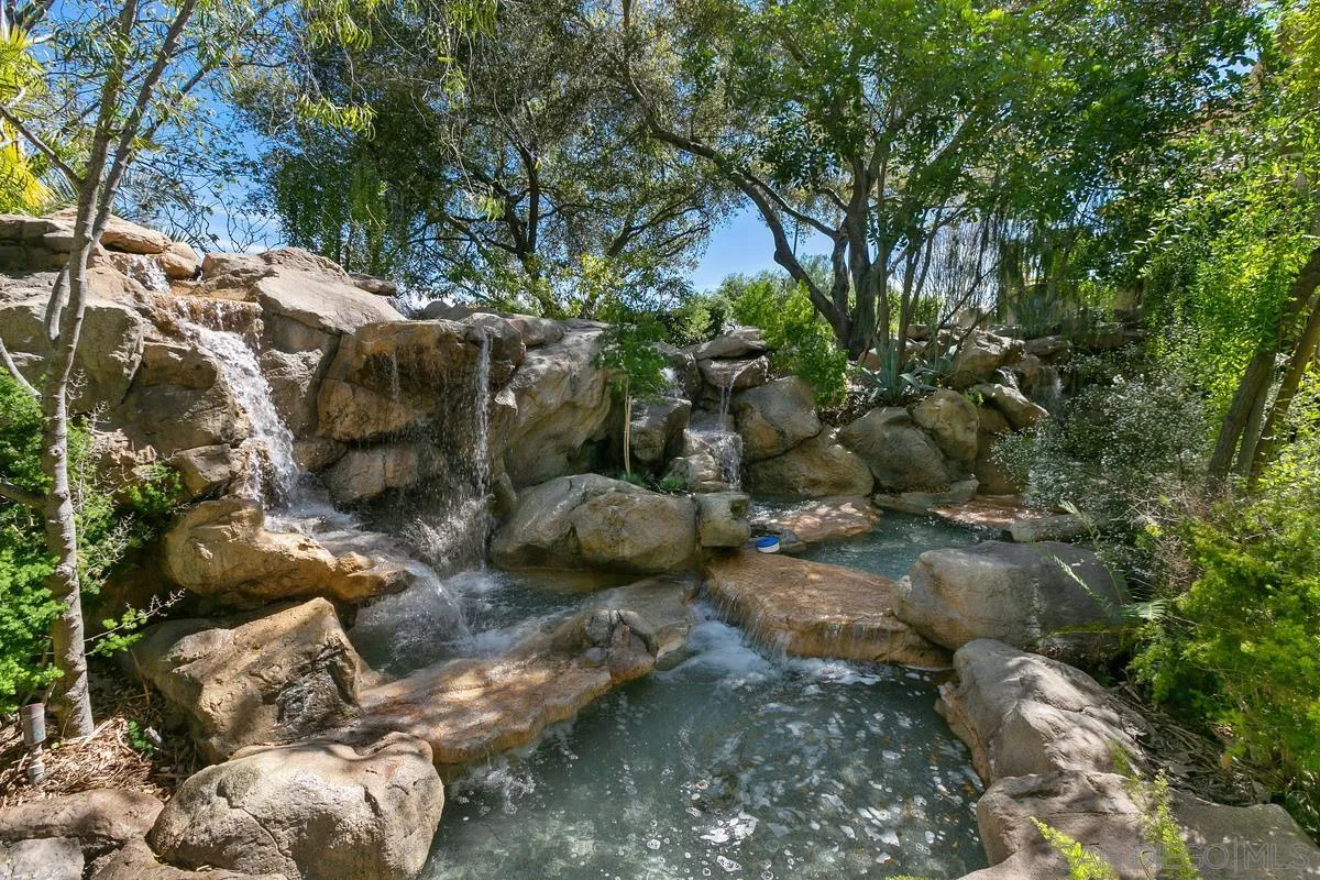 15629 Boulder Mountain Road Poway, CA 92064 - Photo 51 of 64 a backyard of a house with lots of green space