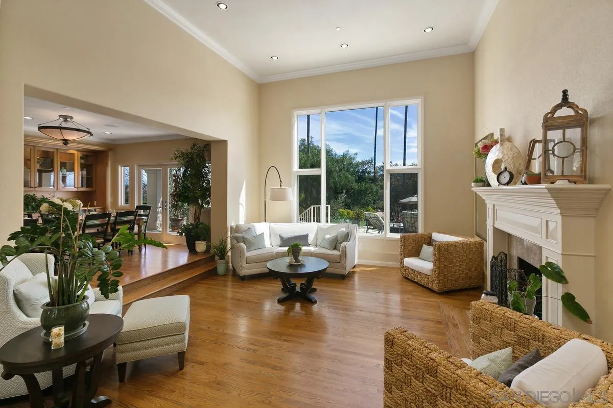 15629 Boulder Mountain Road Poway, CA 92064 - Photo 10 of 64 a living room with furniture a fireplace and a large window
