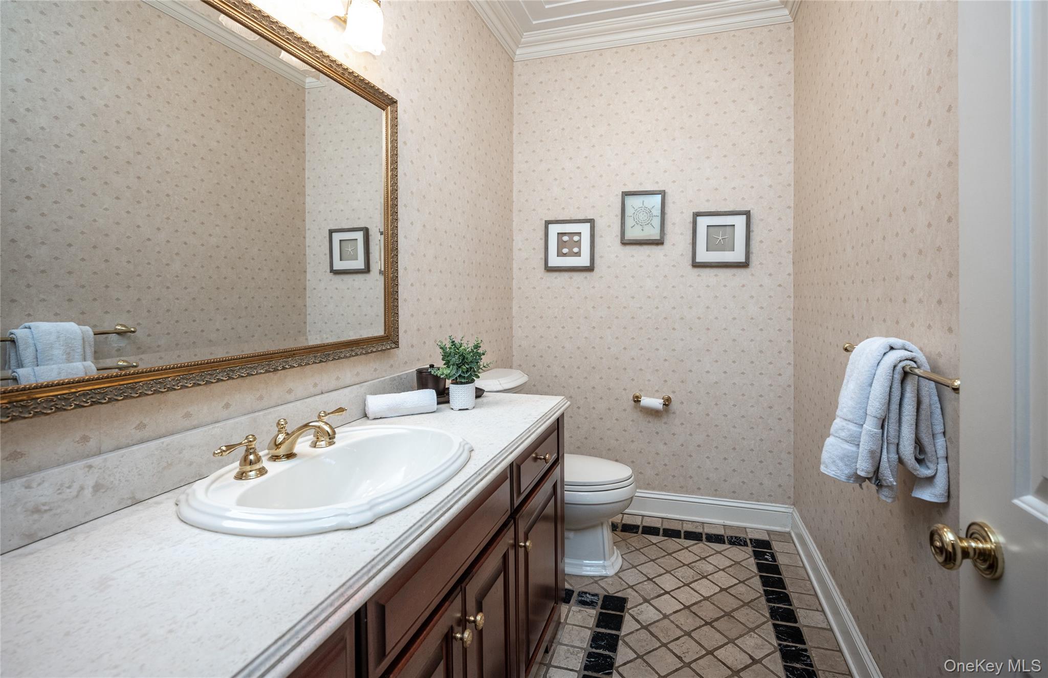 178 Hirst Road Briarcliff Manor, NY 10510 - Photo 17 of 39 Half bath with vanity, light tile patterned floors, and ornamental molding
