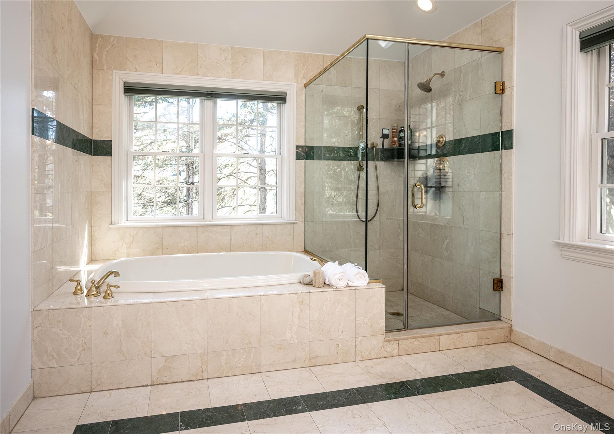 178 Hirst Road Briarcliff Manor, NY 10510 - Photo 21 of 39 Bathroom featuring a shower stall, a garden tub, and inlaid floor details