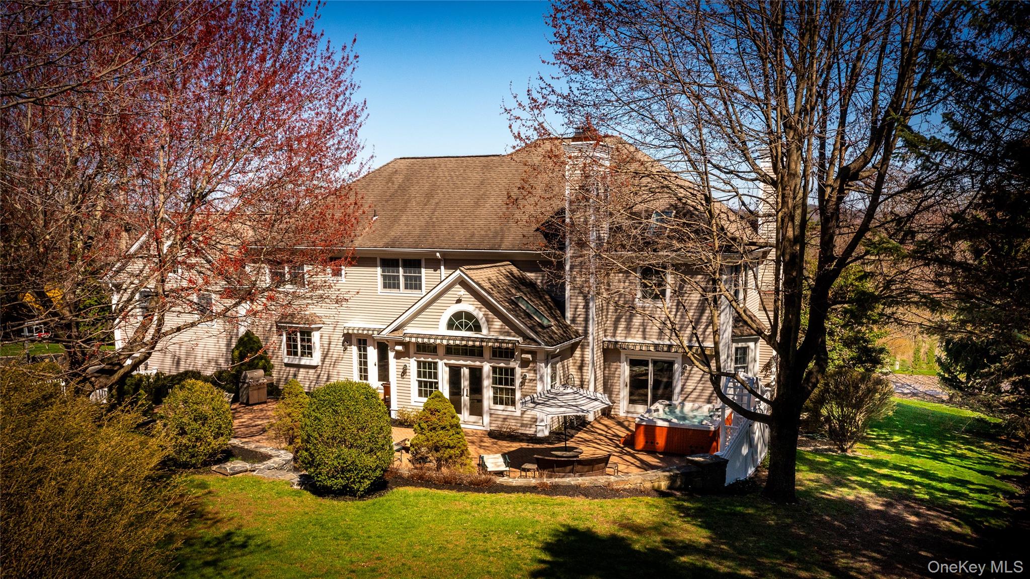 178 Hirst Road Briarcliff Manor, NY 10510 - Photo 37 of 39 Back of property with a yard, a patio area, and a jacuzzi