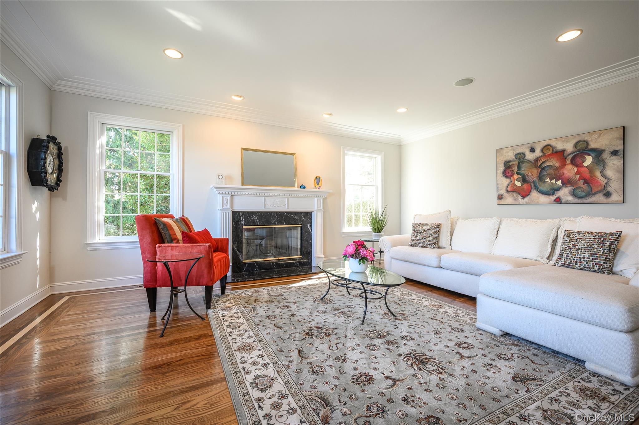178 Hirst Road Briarcliff Manor, NY 10510 - Photo 9 of 39 Living area featuring crown molding, dark wood finished floors, a high end fireplace, and recessed lighting