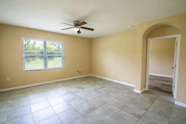a view of an empty room with a window