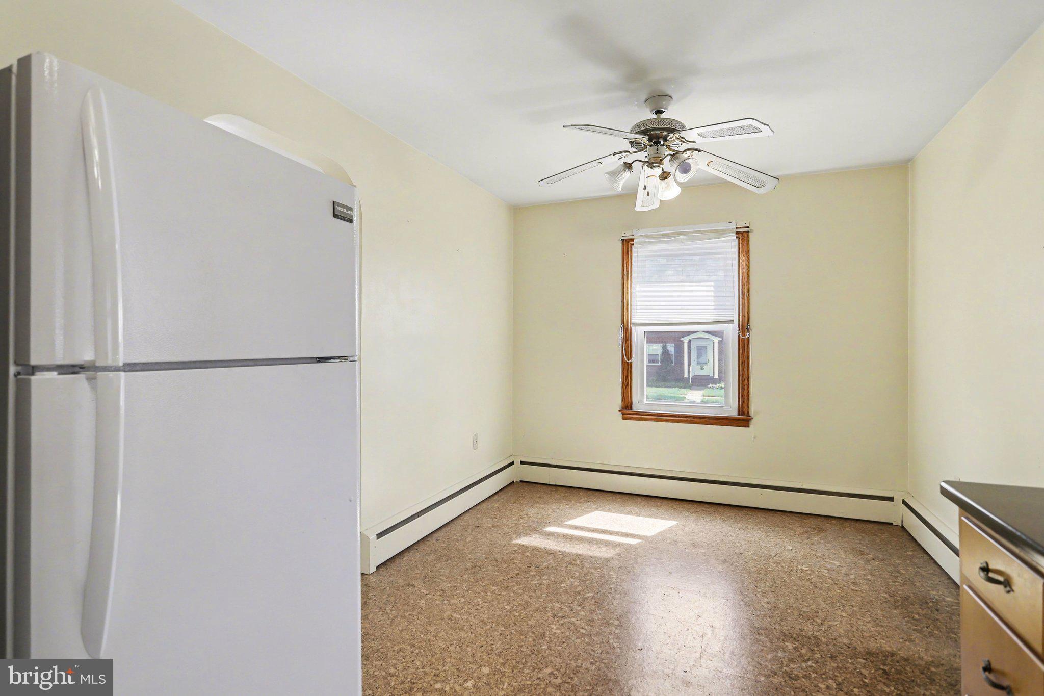 932 East Walnut Street Hanover, PA 17331 - Photo 12 of 44 wooden floor in an empty room with a window