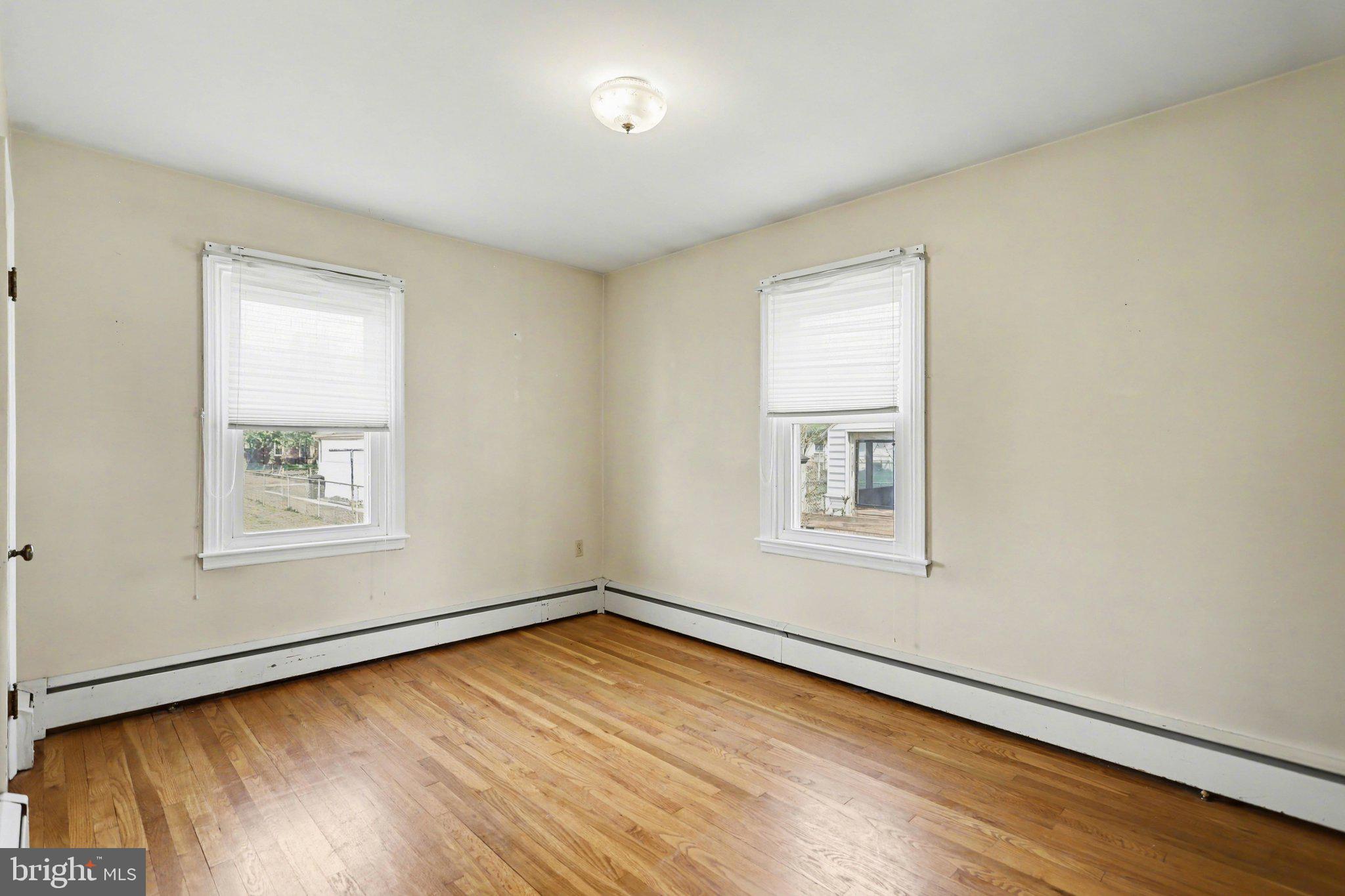 932 East Walnut Street Hanover, PA 17331 - Photo 15 of 44 a view of an empty room with wooden floor and a window