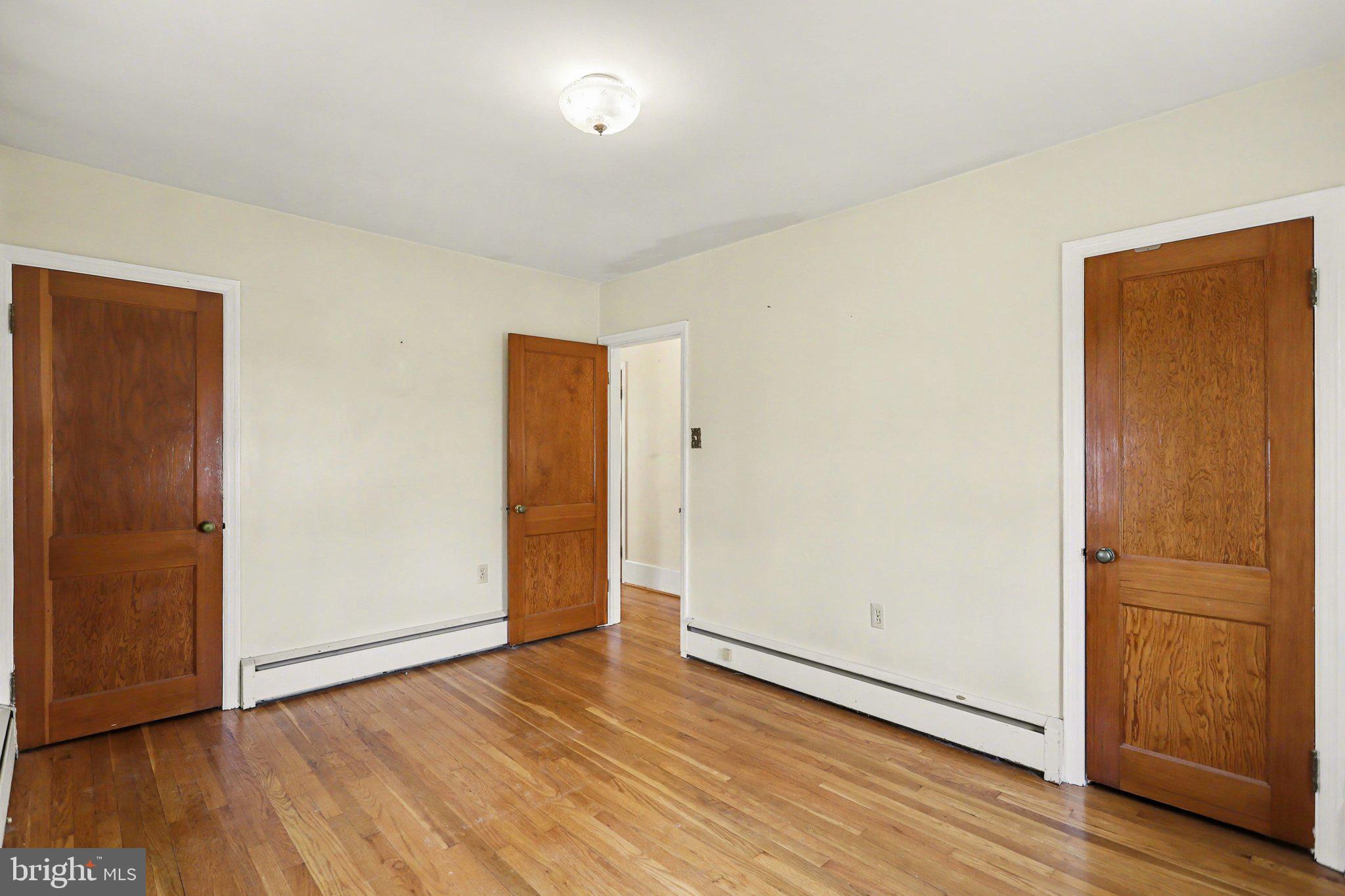 932 East Walnut Street Hanover, PA 17331 - Photo 16 of 44 an empty room with wooden floor and closet