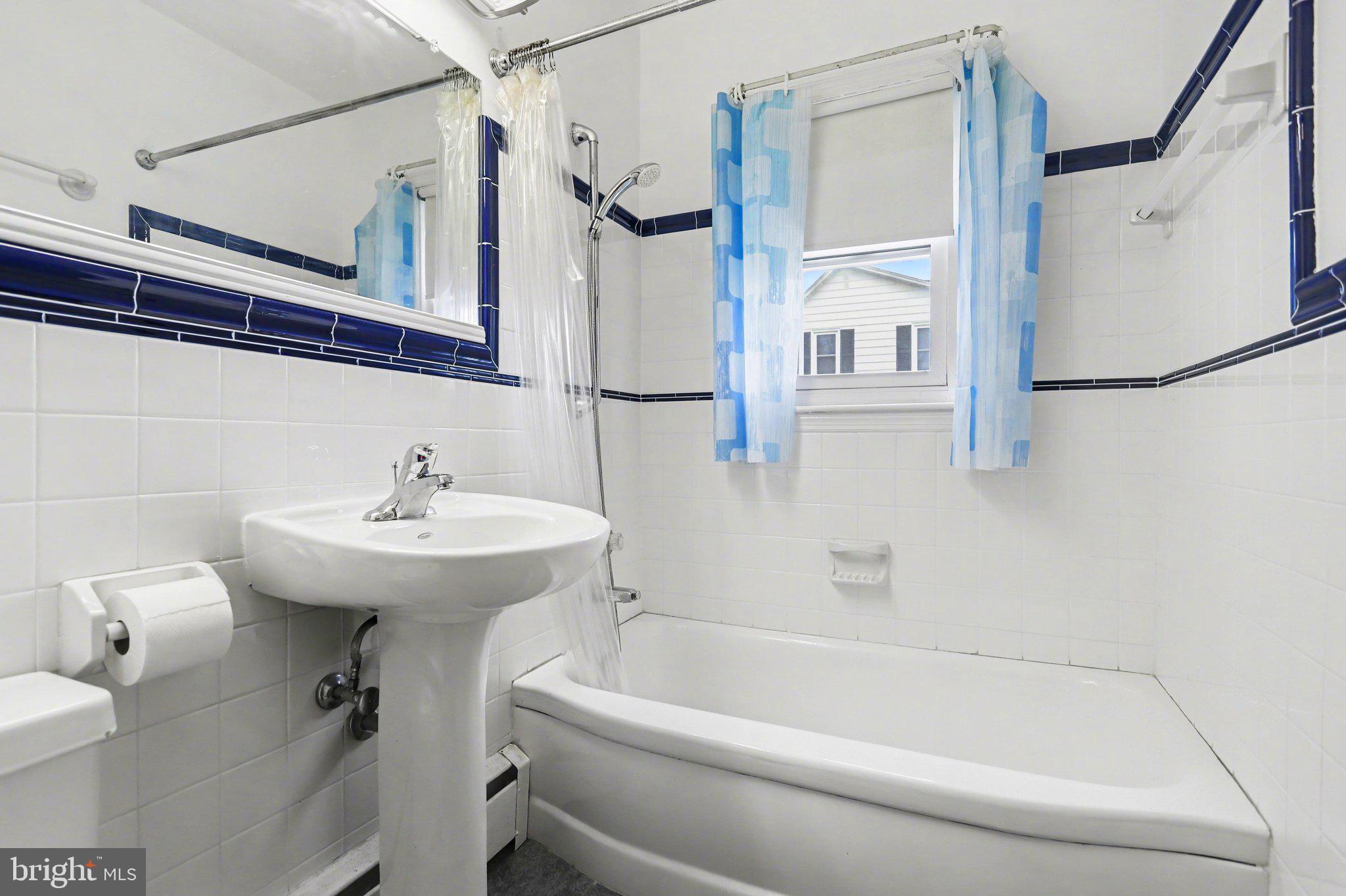 932 East Walnut Street Hanover, PA 17331 - Photo 21 of 44 a bathroom with a sink a toilet and shower