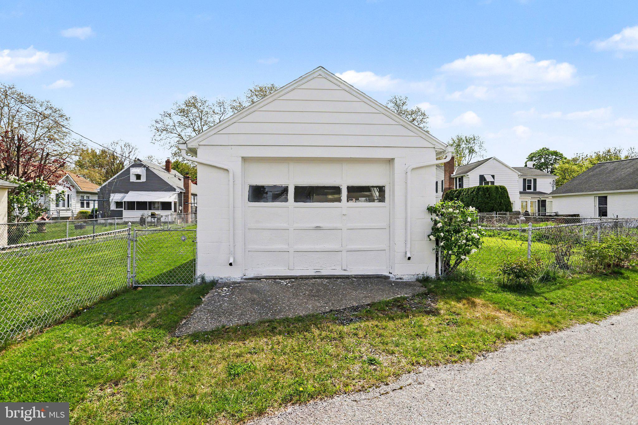932 East Walnut Street Hanover, PA 17331 - Photo 26 of 44 a view of a white house next to a yard and tennis court