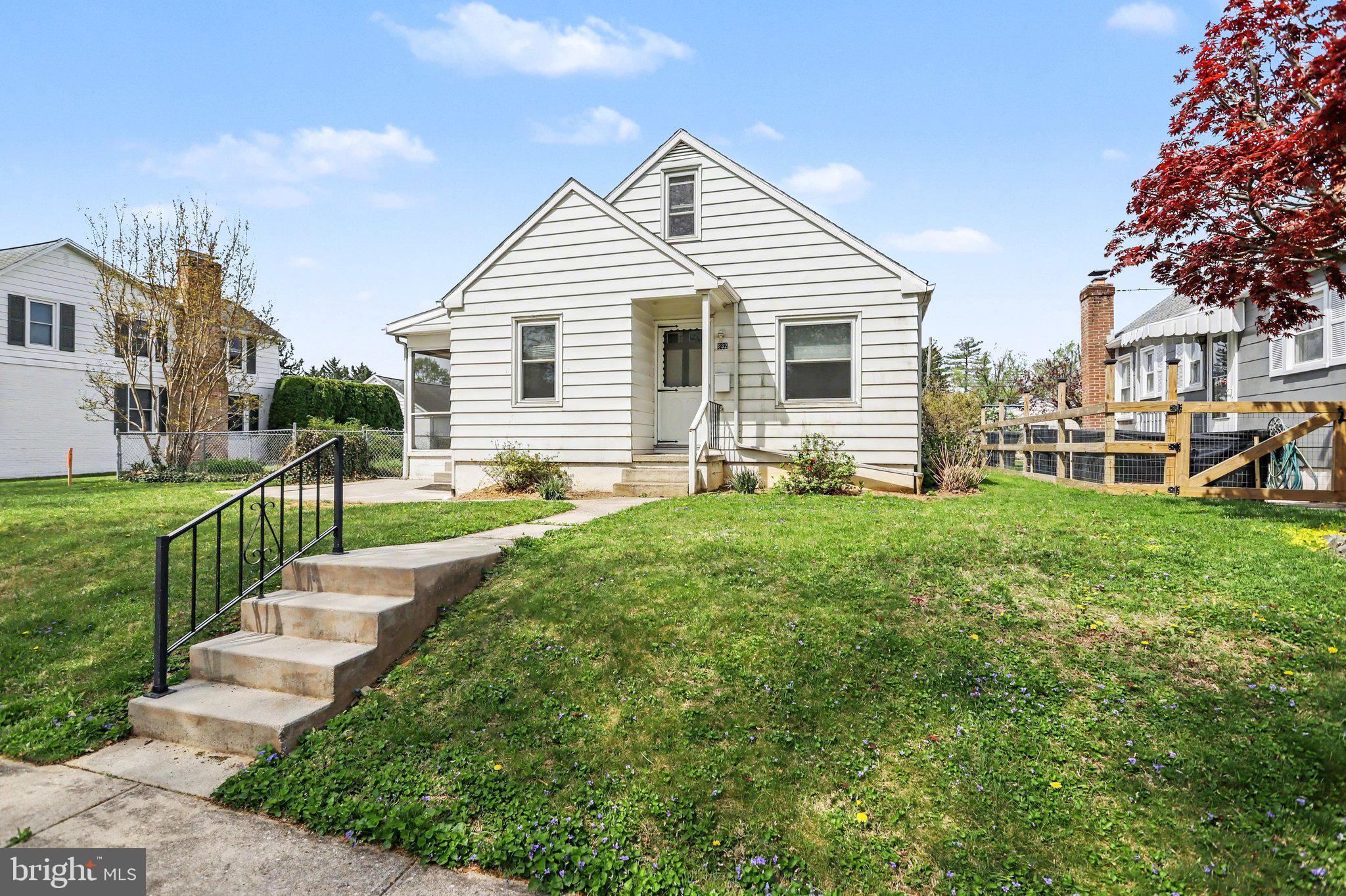 932 East Walnut Street Hanover, PA 17331 - Photo 3 of 44 a front view of a house with a yard and green space