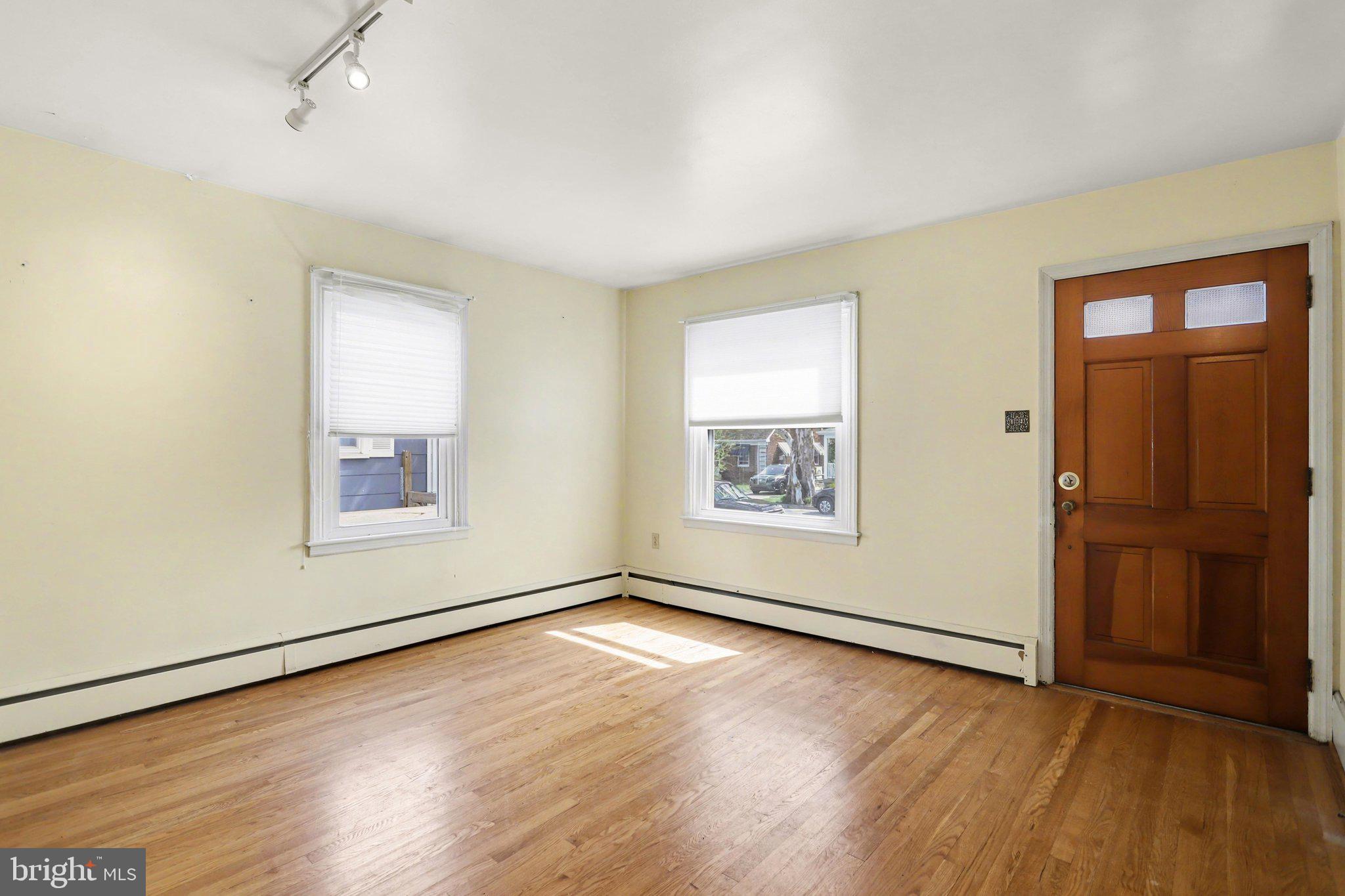 932 East Walnut Street Hanover, PA 17331 - Photo 6 of 44 an empty room with wooden floor and windows