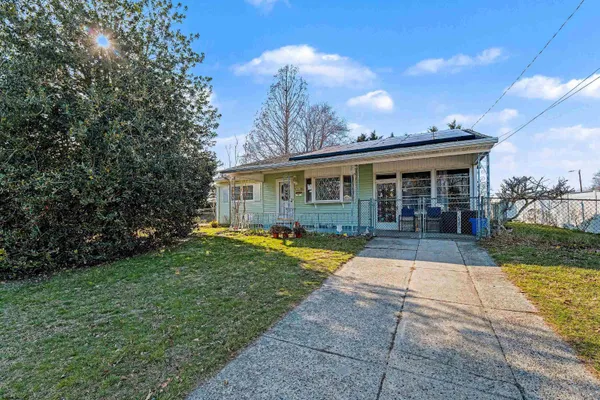 a view of house with yard and entertaining space