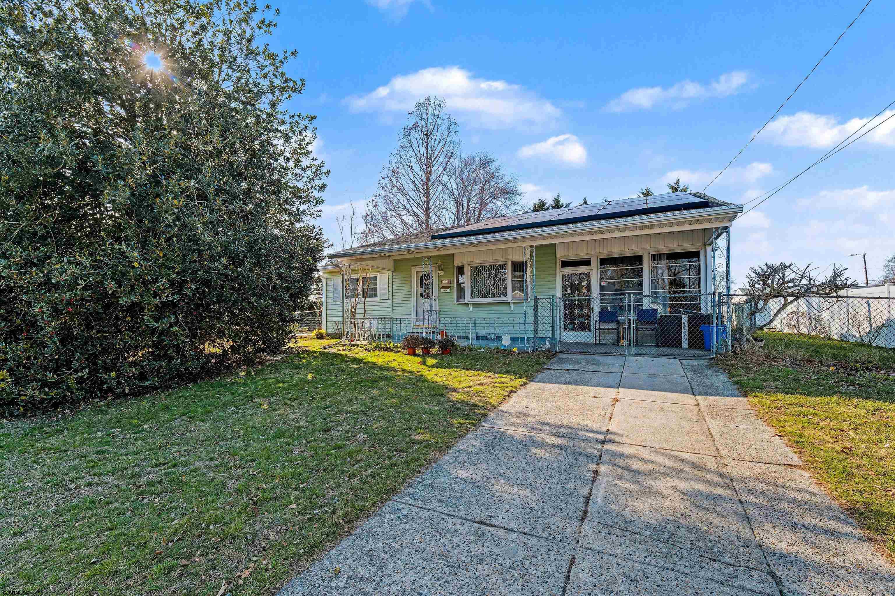 a view of house with yard and entertaining space
