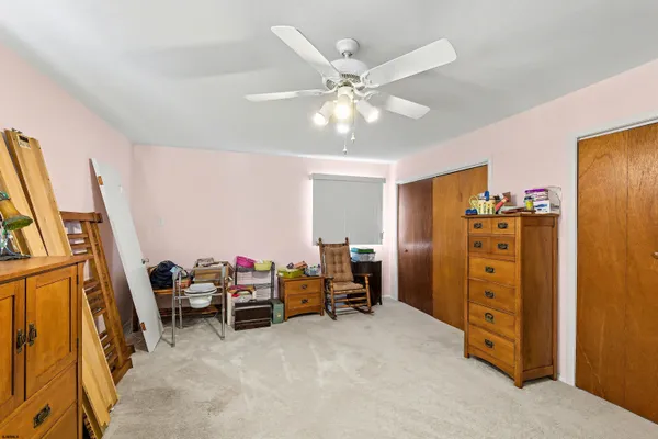 a view of a livingroom with furniture and workspace