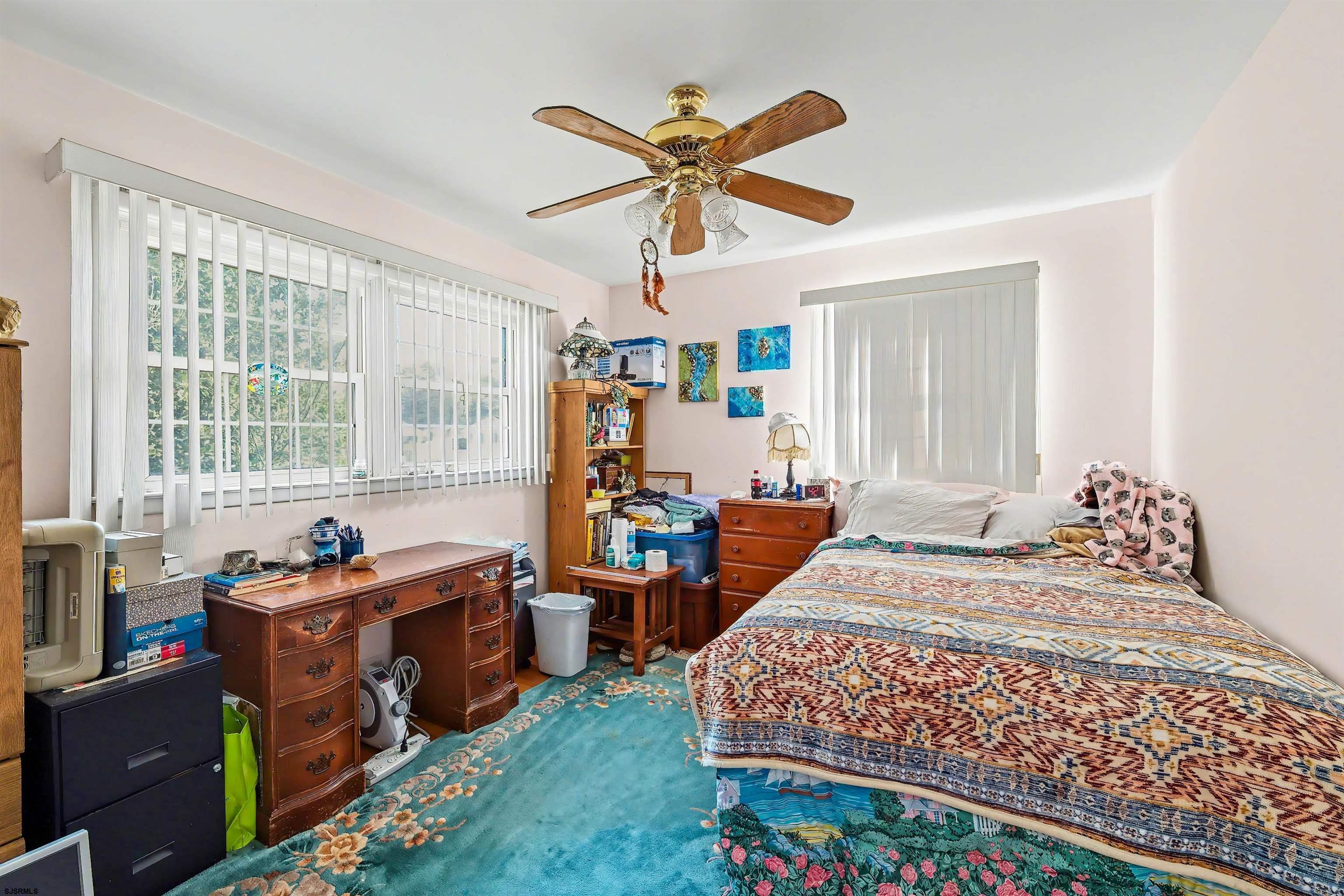 116 Haddon Road Somers Point, NJ 08244 - Photo 15 of 21 a bedroom with a bed and a large window
