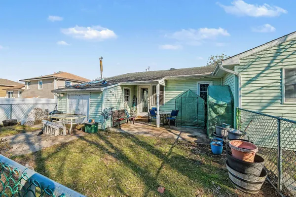a view of house with patio outdoor seating