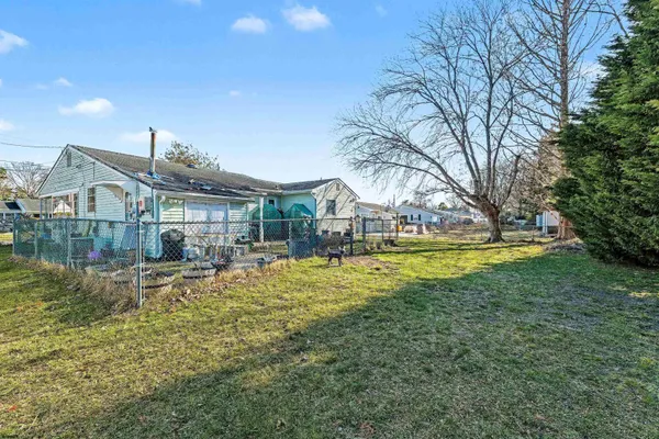 a view of house with outdoor space and swimming pool
