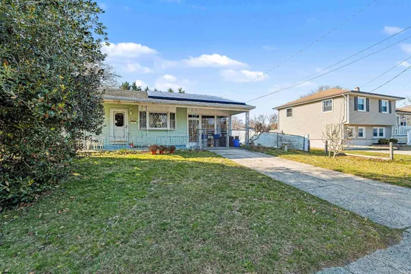 a view of a house with swimming pool and a yard
