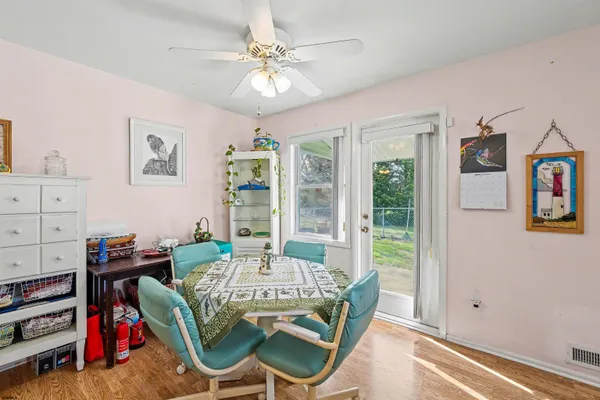 a dining room with furniture and window