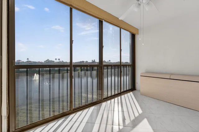 a view of a balcony with wooden floor