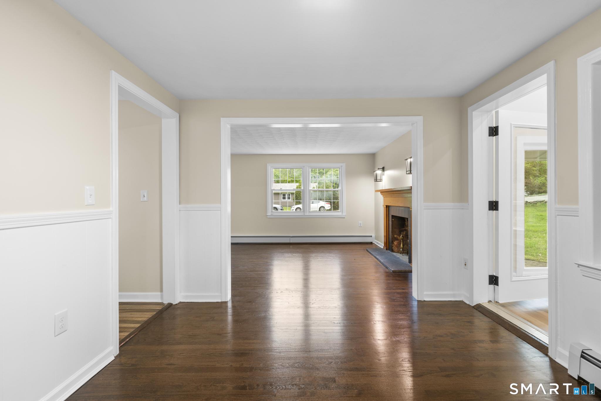 7 Sycamore Terrace Windham, CT 06280 - Photo 8 of 40 a view of an empty room with window and wooden floor