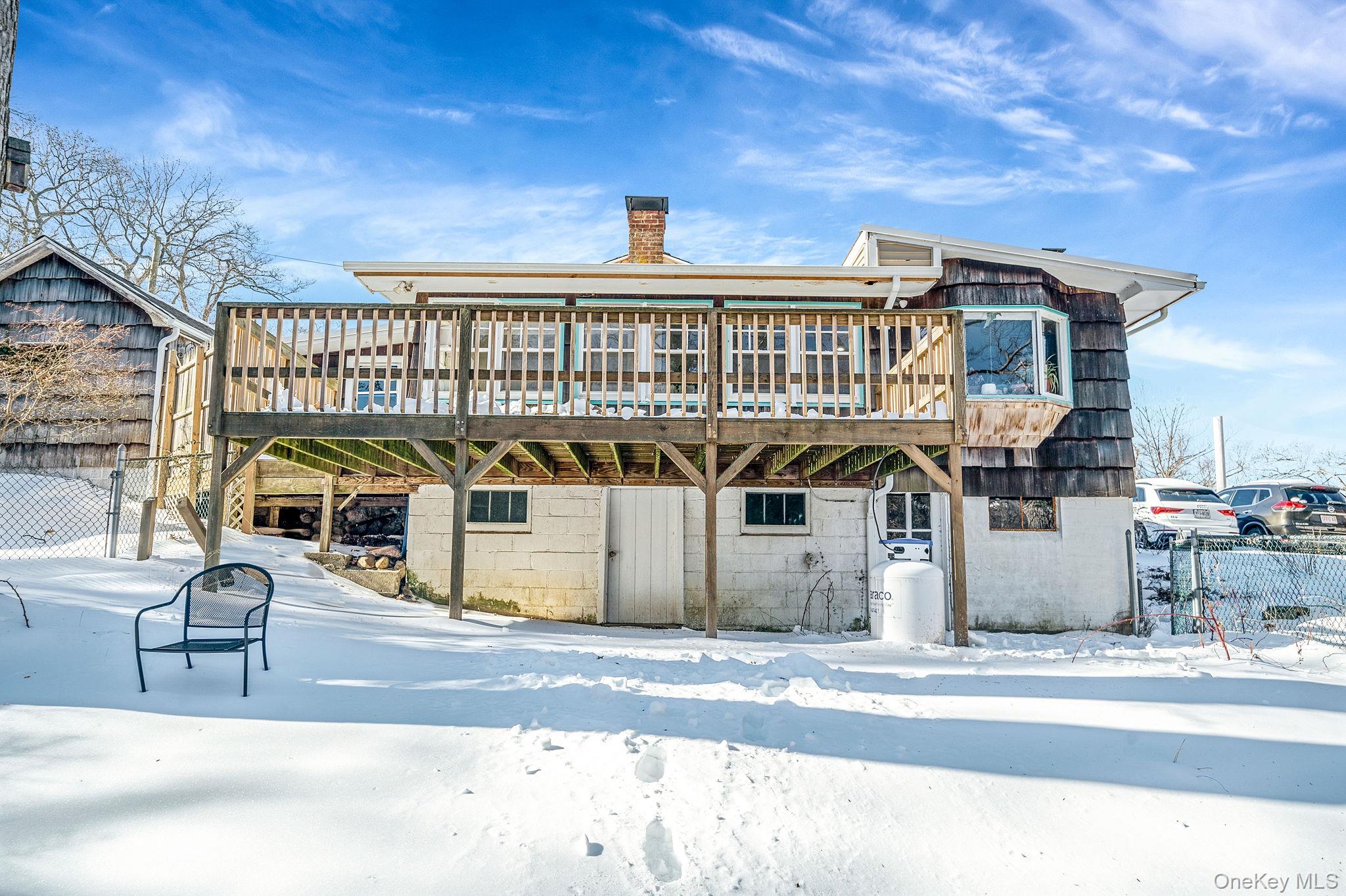 15 Ridge Lane Miller Place, NY 11764 - Photo 17 of 26 a front view of a house with a space